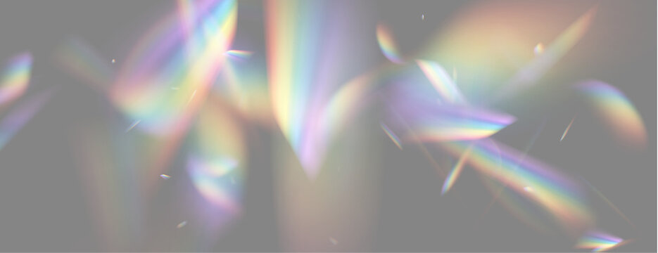 Irregular prism light refractions scatter vibrant rainbow colors across a deep black background. These scattered fragments display soft edges with luminous overlapping hues.
