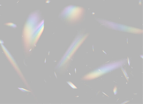 Scattered light refractions create multicolored prism effects against a black background. The elongated shapes display gradient rainbows with varied intensity and softness.