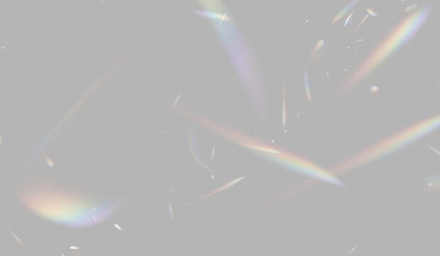 Scattered prism light fragments appear as multicolored slender shapes. These shapes display subtle spectral gradients against the dark backdrop. This effect highlights light refraction with.