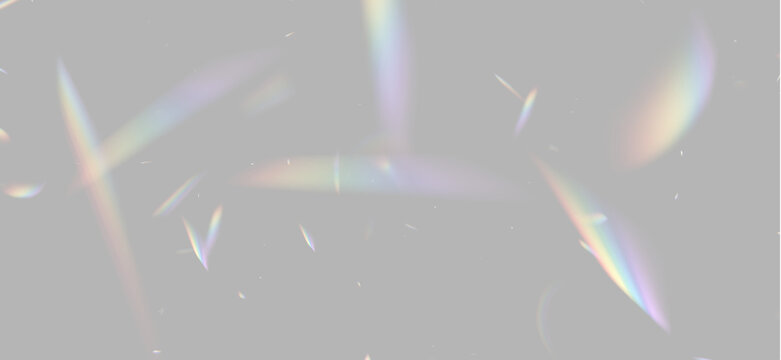 Light refractions create scattered prism effects on a black background. Iridescent spectrum colors diffuse softly in various angular shapes. This image highlights optical dispersion with.