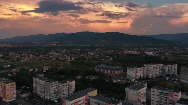 Aerial View of Residential Sofia, Bulgaria at Sunset with Lozen Mountain and Dramatic Clouds