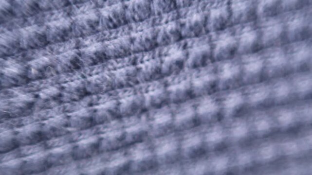 Close-up of a checkered textile texture with abstract motion