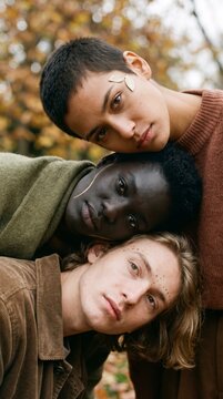 Three Generations With Golden Face Art Stack Heads In An Autumn Forest Portrait