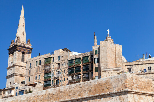 Old stone houses and spires creates skyline of the old town of Valletta, Malta. Maltese Capital city view on a sunny day