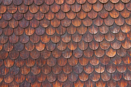 Traditional alpine chalet wooden shingle texture background