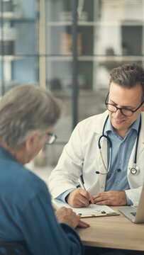 Doctor writing a prescription at clinic