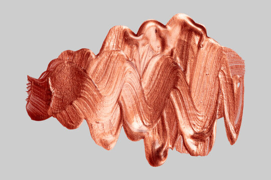Copper metallic paint smear creating abstract texture