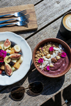 Acai bowl and fruit salad for healthy outdoor breakfast