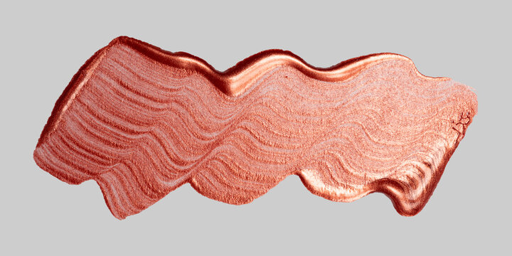 Rose gold metallic paint brushstroke shimmering texture