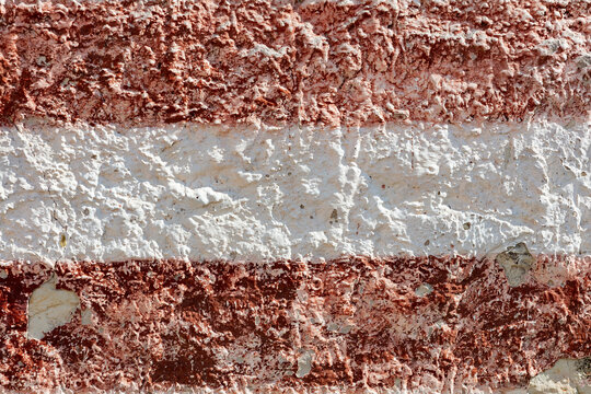 Weathered red and white striped wall texture background