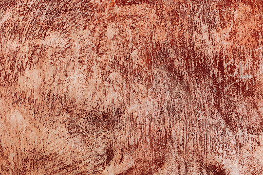 Rusty red weathered wall texture with vertical streaks
