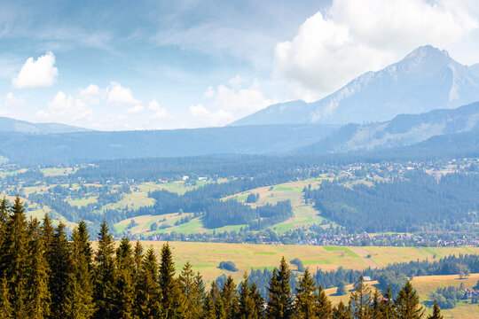 mountain landscape of Poland in late summertime. wonderful view of High Tatra ridge above Zakopane village valley. vacation place in Europe