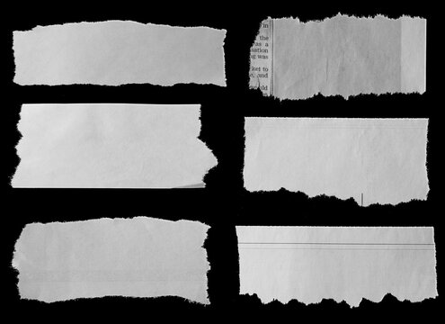 Torn papers on black
