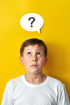 Boy Looking Up with Question Mark