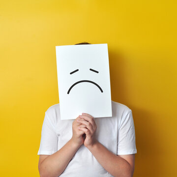 Boy Holding a Sad Face Card