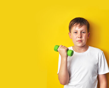 Boy Holding a Green Dumbbell