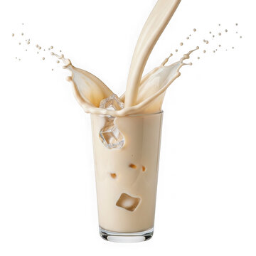 Iced coffee splash in a glass with milk and ice cubes isolated on white background
