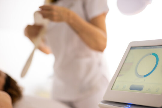 Ultrasound body treatment device in modern aesthetic clinic