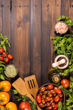 Fresh culinary ingredients for healthy cooking on wooden background