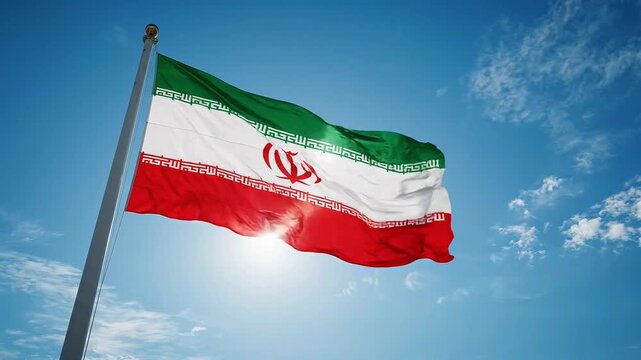 National flag of iran waving against a clear blue sky with sunlight