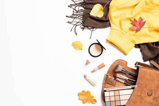 Autumn cloth and accessories at white background.