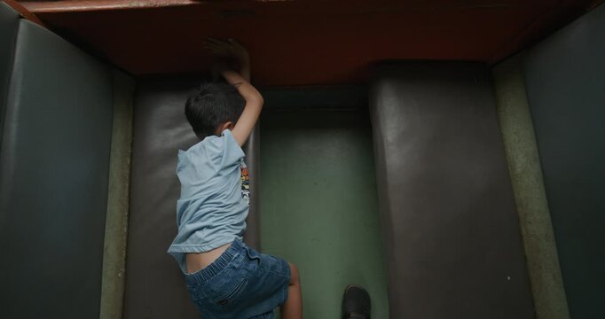 Little asian boy enjoy travel in local old train backpacker kids Thailand