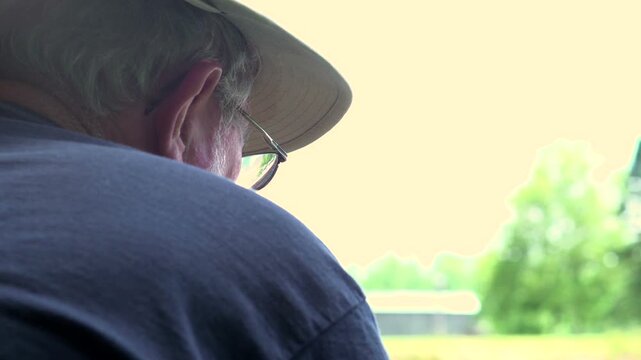 Man fishing seen from behind in outdoors
