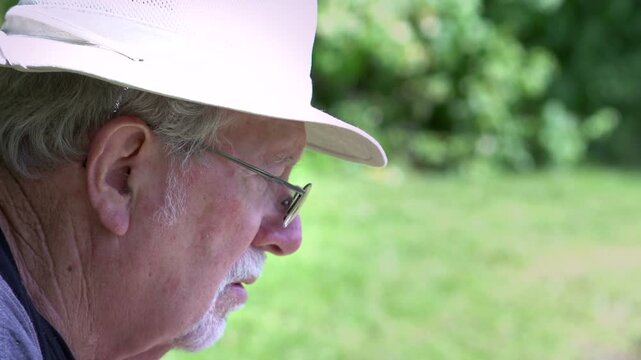 Man watching water as he fishes in nature

