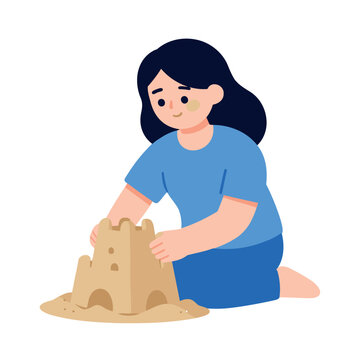 Young girl kneeling on the beach building a sandcastle