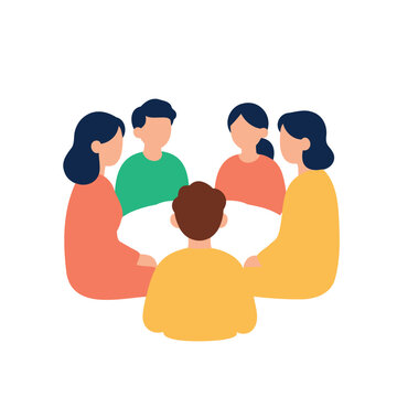 Diverse group of people sitting around a white table discussing ideas