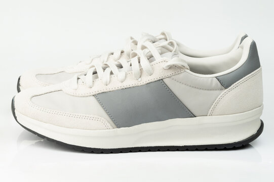 Casual sneakers displayed on a plain white surface