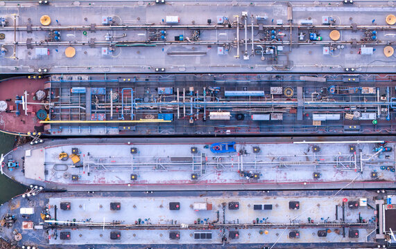 Aerial Top Down View of Industrial Cargo Barges and Tankers Moored Together