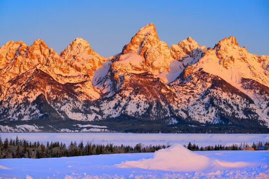 Sunrise on Teton Mountain Range in Wyoming Alpen Glow Orange and Pink on Rugged Mountains
