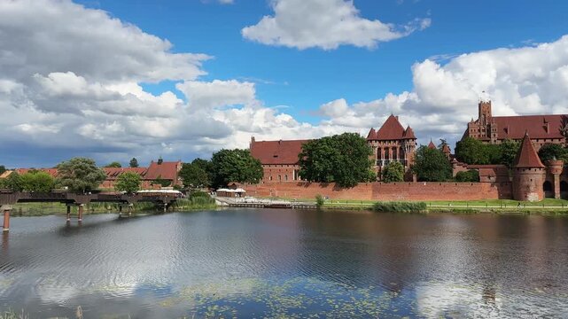 General view Malbork Castle from Nogat River opposite bank, Poland