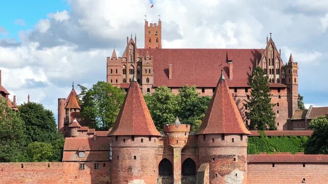 General view Malbork Castle from Nogat River opposite bank, Poland