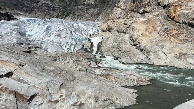 Nigardsbreen glacier toe in valley at sunny day, Norway