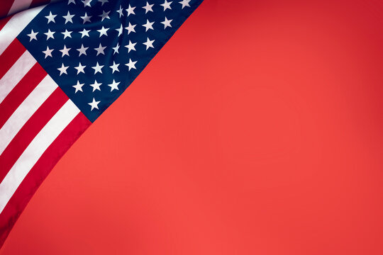 American flag on red background with copy space, strong patriotic concept for USA holidays, Independence Day, Flag Day and Constitution Day design use.