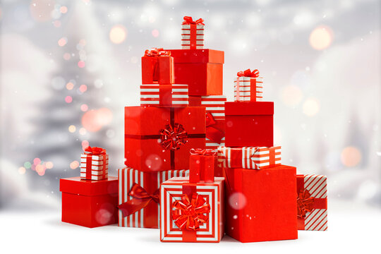 Christmas, New Year gift boxes for holidays promotions. Red and striped wrappers, lush bows.