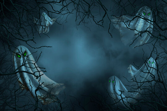 Floating scary white fabric ghost appeared among in the dark forest in a nightmare. Creepy ghost Halloween character