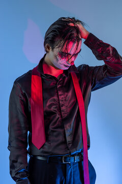 young guy with skull makeup celebrating a Halloween party