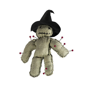 Homemade voodoo doll in a conical witch hat, Halloween decor on isolated background.