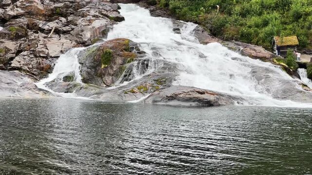 Bottom view of waterfall Hellesyltfossen in Hellesylt village, Norway