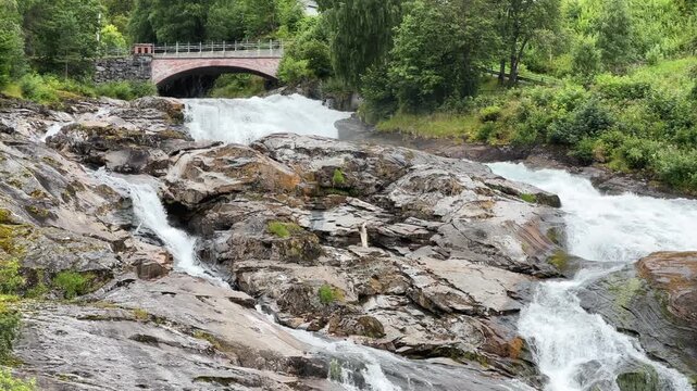 Bottom view of waterfall Hellesyltfossen in Hellesylt village, Norway
