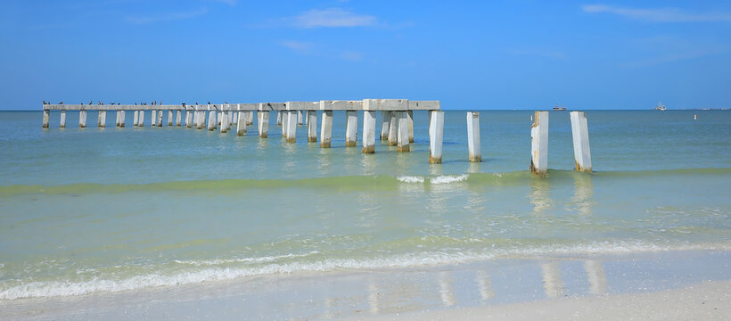 The damaged Fort Myers Beach Fishing Pier.  The pier was destroyed by Hurricane Ian in 2022.  Construction began in August 2026 to repair the pier in Fort Myers Beach, Florida, USA. 
