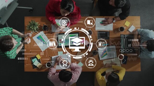 Group of Diverse Professionals Collaborating on Education Technology Strategies with Digital Icons Above a Table in Office Setting. Entropy.