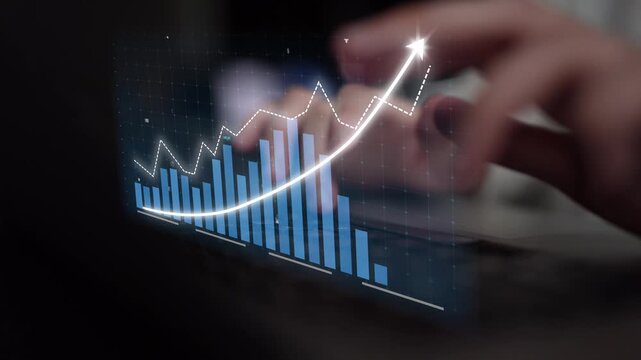 A dynamic image depicting a financial growth concept, featuring hands typing on a laptop with a digital graph illustrating upward revenue trends and statistics. Copula