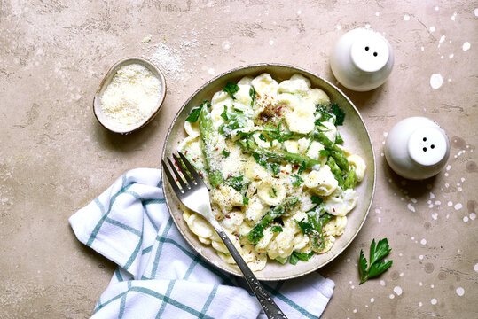 Pasta orecchiete with asparagus in a cream sause. Top view with copy space.