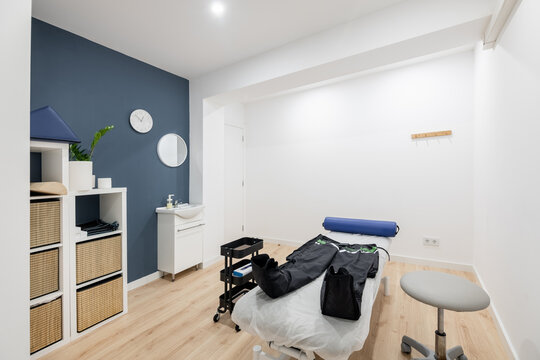 Physiotherapy clinic room with compression therapy equipment