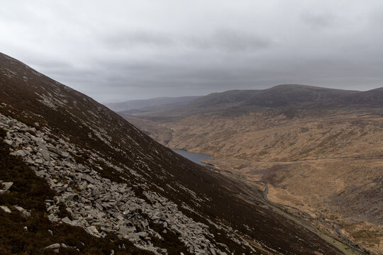 Natural lake landscape with mountains and dramatic clouds in Mourne Mountains near Silent Valley mountain park , United Kingdom