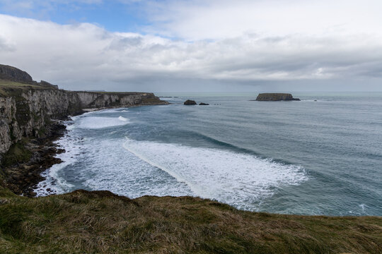 Stunning coastal cliffs and turquoise waters along the Northern Irish coast
